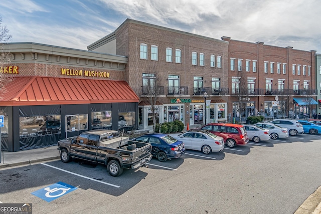 view of commercial location with uncovered parking