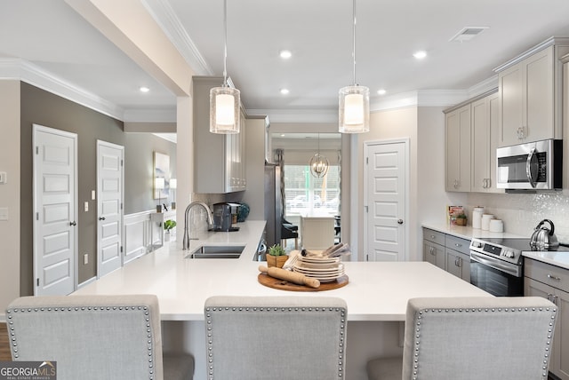 113 Silver Leaf Trce, Douglasville, GA 30134 - kitchen featuring stainless steel appliances, visible vents, a sink, crown molding, and gray cabinetry