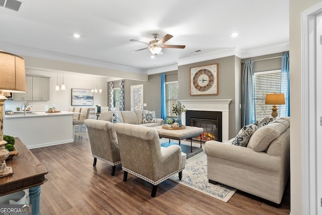 113 Silver Leaf Trce, Douglasville, GA 30134 - living room featuring a glass covered fireplace, wood finished floors, visible vents, and ceiling fan