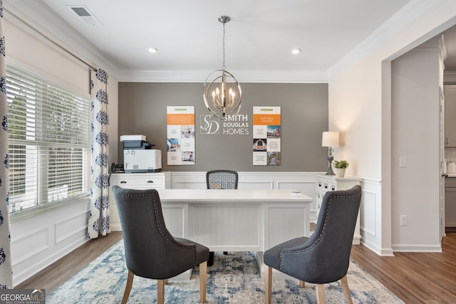 113 Silver Leaf Trce, Douglasville, GA 30134 - dining space with visible vents, an inviting chandelier, wood finished floors, crown molding, and a decorative wall