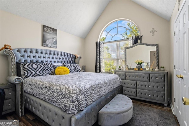 bedroom featuring lofted ceiling and wood finished floors