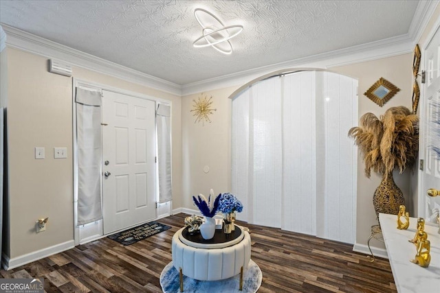 entrance foyer with baseboards, dark wood-style flooring, and crown molding