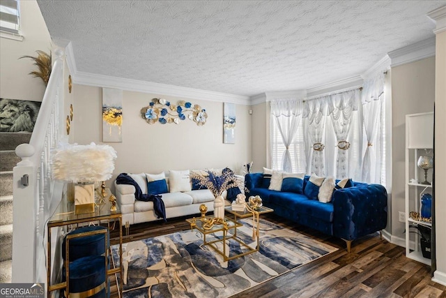 living room with crown molding, wood finished floors, and a textured ceiling