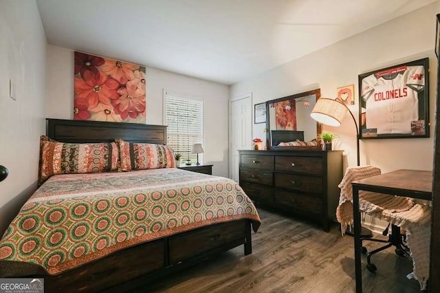 bedroom featuring wood finished floors