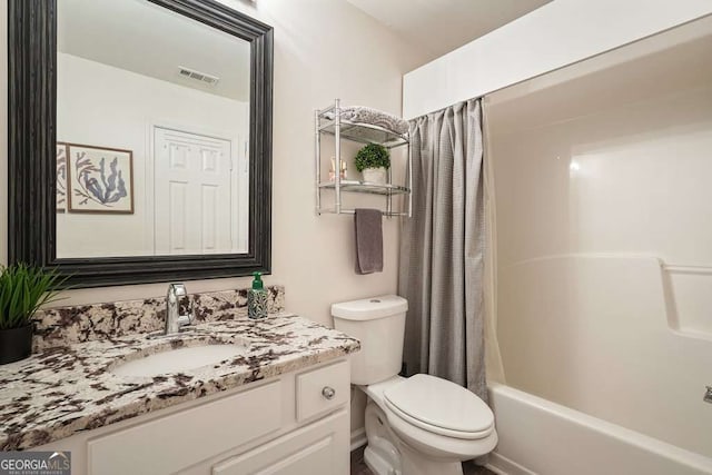 bathroom with visible vents, vanity, shower / bathtub combination with curtain, and toilet