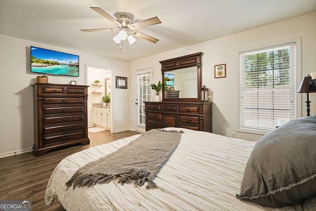 bedroom with ceiling fan, baseboards, dark wood-style flooring, and ensuite bathroom