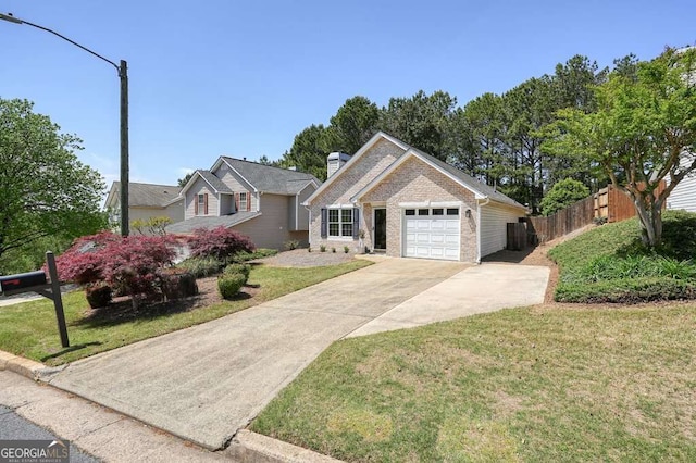 single story home featuring a front lawn, an attached garage, concrete driveway, and fence
