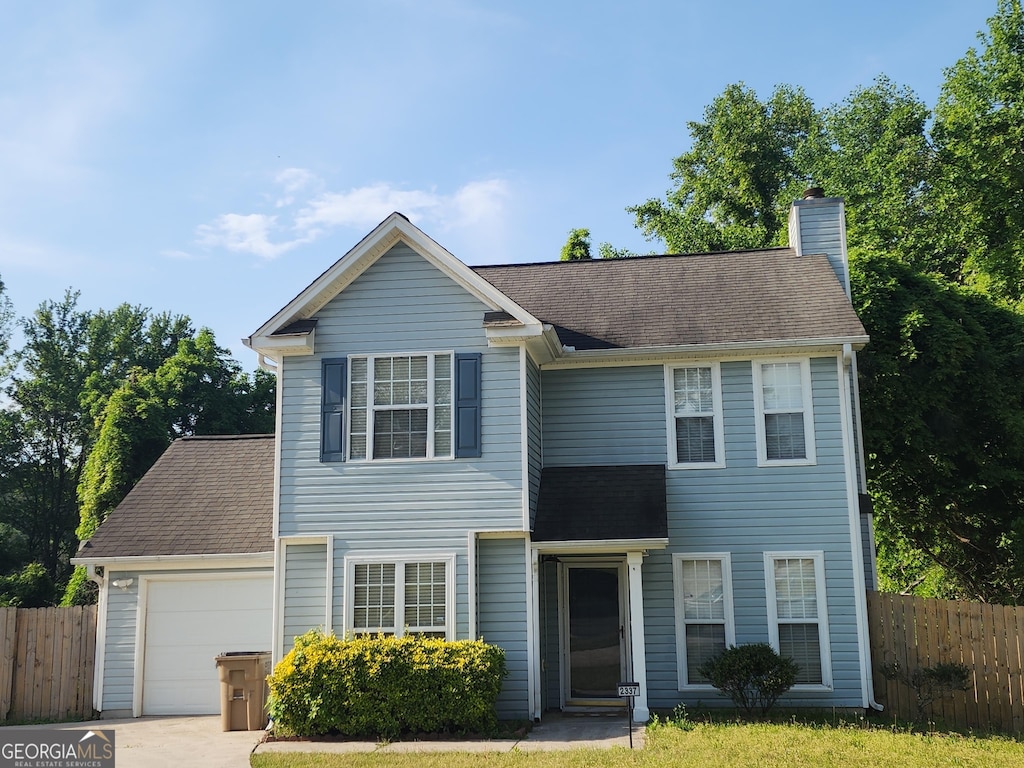 2337 Carousel Park Dr, Morrow, GA 30260 - traditional-style home featuring fence, roof with shingles, a chimney, and a garage
