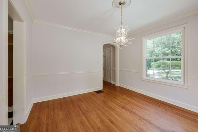 490 Mcwhorter Dr, Athens, GA 30606 - unfurnished dining area with arched walkways, wood finished floors, ornamental molding, and a chandelier