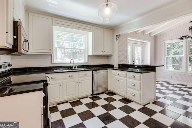 490 Mcwhorter Dr, Athens, GA 30606 - kitchen featuring appliances with stainless steel finishes, light floors, a peninsula, dark countertops, and white cabinets