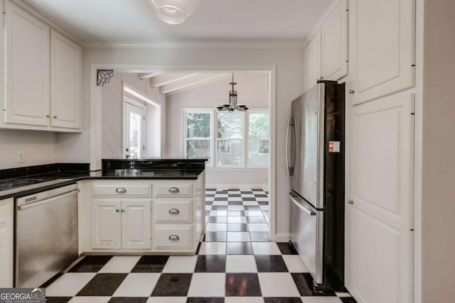 490 Mcwhorter Dr, Athens, GA 30606 - kitchen with appliances with stainless steel finishes, dark flooring, a chandelier, dark countertops, and white cabinets