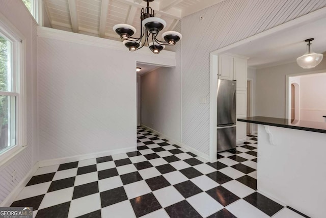 490 Mcwhorter Dr, Athens, GA 30606 - unfurnished dining area featuring tile patterned floors, a chandelier, wooden walls, and beam ceiling