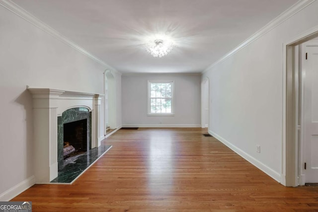 490 Mcwhorter Dr, Athens, GA 30606 - unfurnished living room with wood finished floors, ornamental molding, and a high end fireplace