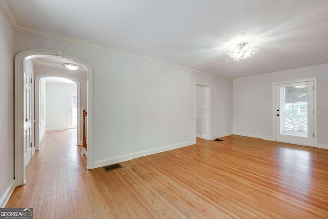 490 Mcwhorter Dr, Athens, GA 30606 - spare room featuring arched walkways, light wood finished floors, and crown molding