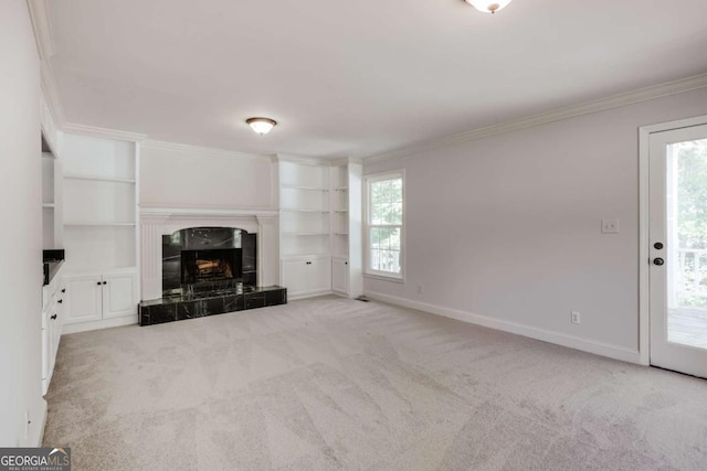 490 Mcwhorter Dr, Athens, GA 30606 - unfurnished living room featuring crown molding, light colored carpet, built in features, and a tiled fireplace