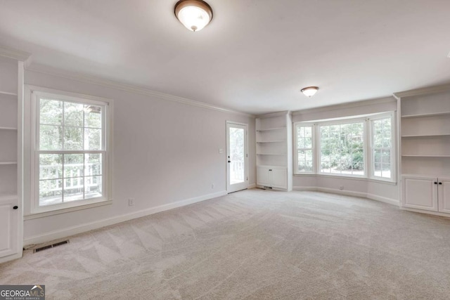 490 Mcwhorter Dr, Athens, GA 30606 - spare room with crown molding, light carpet, plenty of natural light, and built in shelves