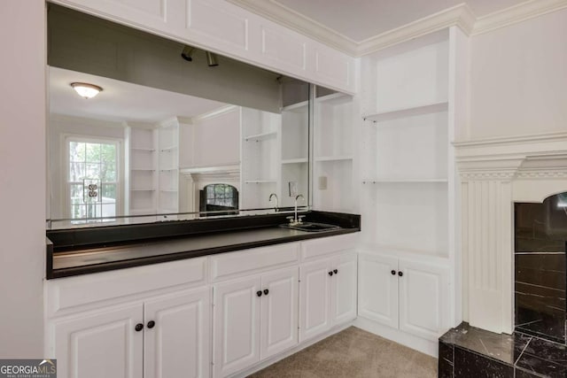 490 Mcwhorter Dr, Athens, GA 30606 - kitchen featuring open shelves, dark countertops, white cabinets, ornamental molding, and light carpet