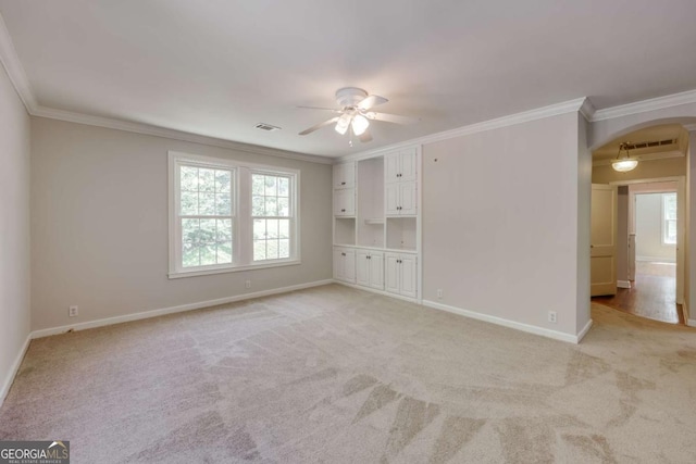490 Mcwhorter Dr, Athens, GA 30606 - empty room with arched walkways, a ceiling fan, ornamental molding, and light colored carpet