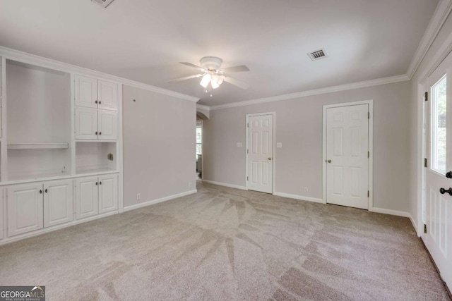 490 Mcwhorter Dr, Athens, GA 30606 - unfurnished bedroom featuring light carpet, ornamental molding, ceiling fan, and multiple closets