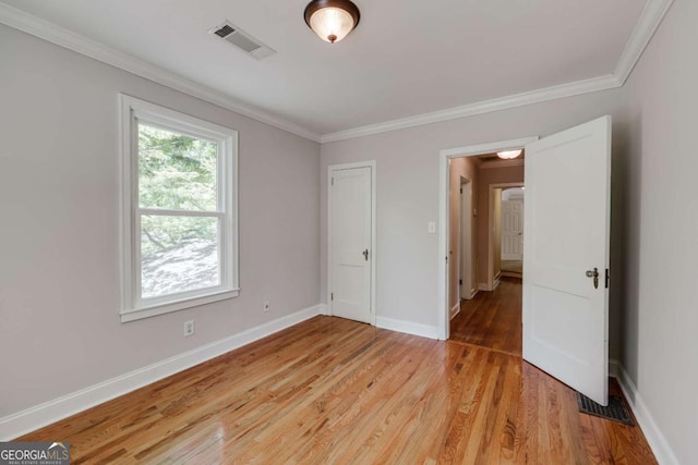 490 Mcwhorter Dr, Athens, GA 30606 - unfurnished bedroom with light wood-style flooring and crown molding