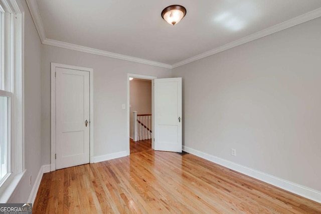 490 Mcwhorter Dr, Athens, GA 30606 - unfurnished bedroom featuring light wood-type flooring and ornamental molding