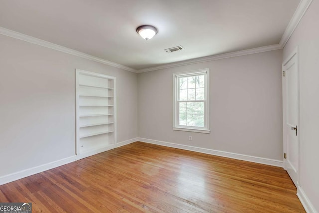 490 Mcwhorter Dr, Athens, GA 30606 - empty room featuring built in features, wood finished floors, and ornamental molding