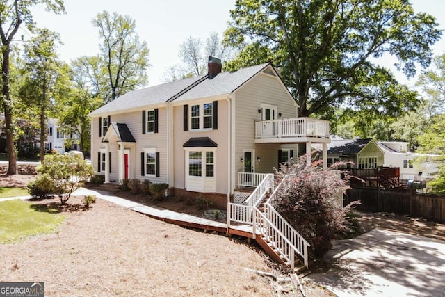 490 Mcwhorter Dr, Athens, GA 30606 - colonial-style house featuring a chimney, stairway, and a balcony