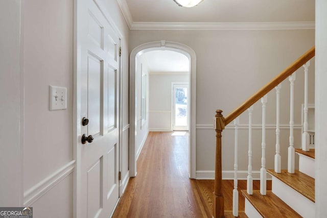 490 Mcwhorter Dr, Athens, GA 30606 - foyer featuring ornamental molding, wood finished floors, arched walkways, and stairway