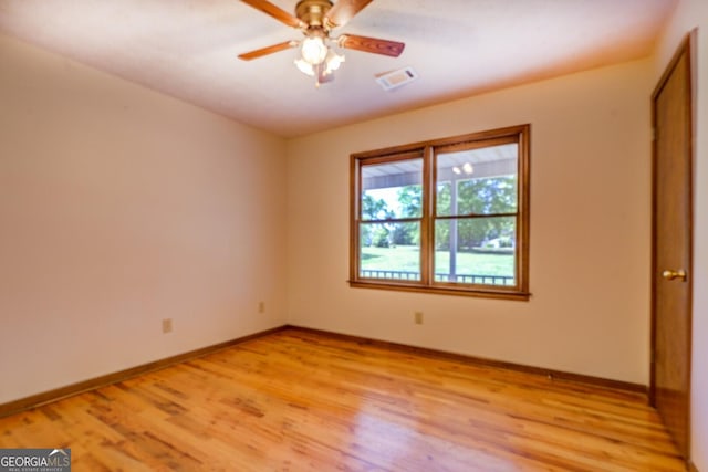 unfurnished bedroom featuring ceiling fan, baseboards, visible vents, and light wood-style flooring
