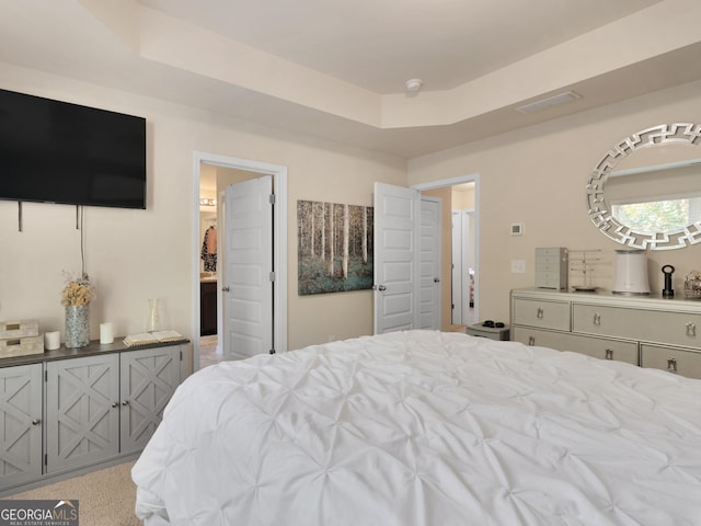 bedroom with a tray ceiling