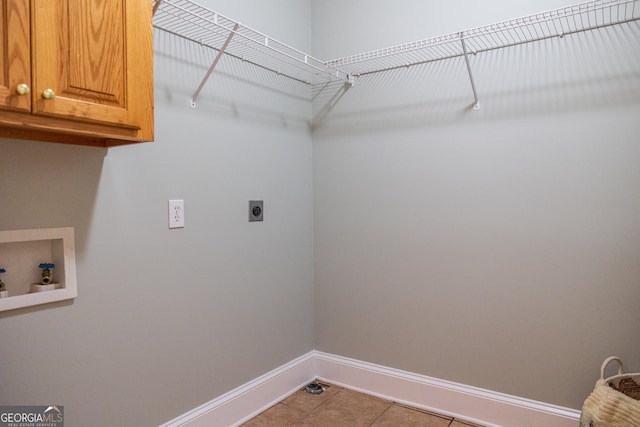 109 Trudie Ln, Macon, GA 31216 - washroom featuring cabinet space, hookup for an electric dryer, hookup for a washing machine, and tile patterned floors