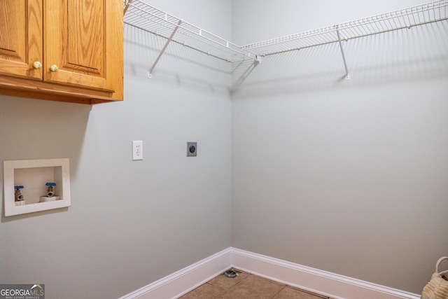 109 Trudie Ln, Macon, GA 31216 - laundry area with cabinet space, electric dryer hookup, hookup for a washing machine, and tile patterned floors