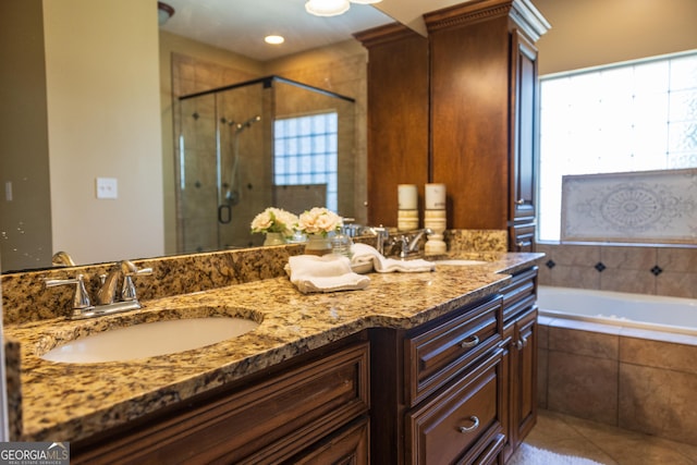 109 Trudie Ln, Macon, GA 31216 - bathroom with a shower stall, double vanity, a garden tub, and tile patterned floors