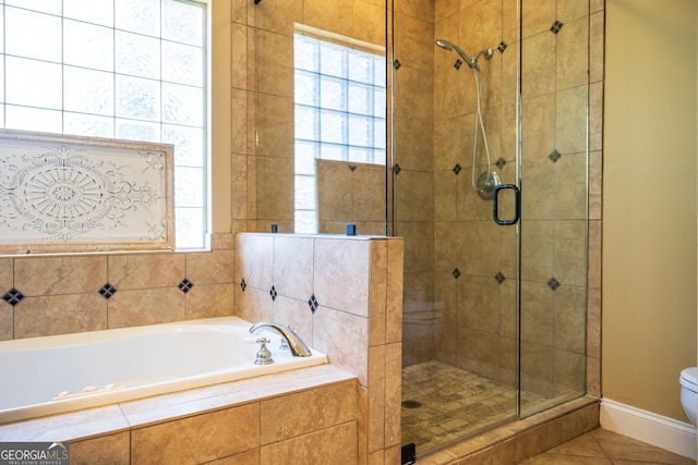109 Trudie Ln, Macon, GA 31216 - bathroom with a stall shower, a garden tub, and tile patterned floors