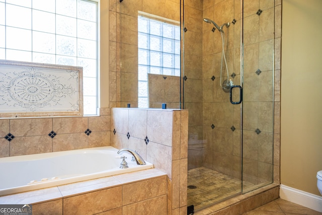109 Trudie Ln, Macon, GA 31216 - full bath featuring a shower stall, a garden tub, and tile patterned flooring