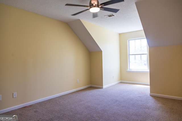109 Trudie Ln, Macon, GA 31216 - bonus room featuring carpet floors, a ceiling fan, a textured ceiling, and vaulted ceiling