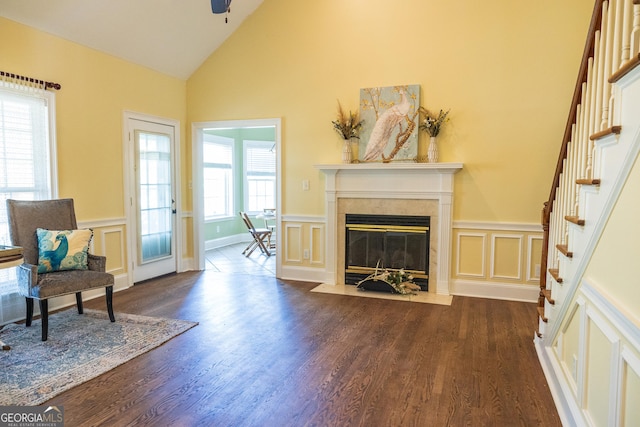 109 Trudie Ln, Macon, GA 31216 - living area featuring a decorative wall, a high end fireplace, dark wood-style floors, a wainscoted wall, and high vaulted ceiling