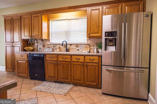 109 Trudie Ln, Macon, GA 31216 - kitchen featuring stainless steel fridge with ice dispenser, dishwasher, and brown cabinets