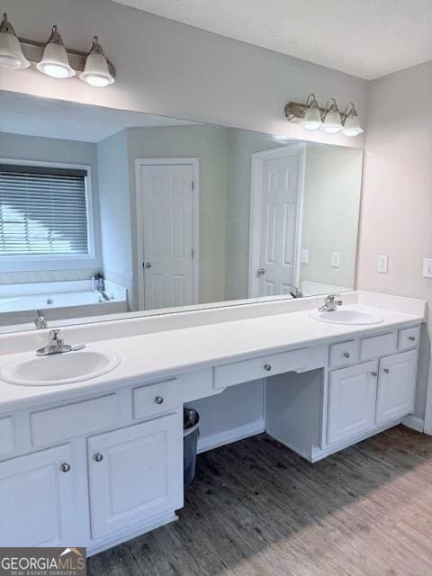 622 River Rock Cir, Jefferson, GA 30549 - full bath featuring double vanity, wood finished floors, and a bath