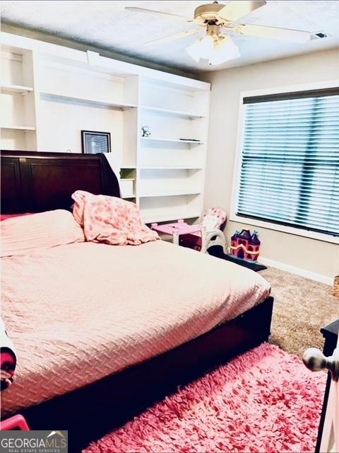 622 River Rock Cir, Jefferson, GA 30549 - carpeted bedroom with baseboards and a ceiling fan
