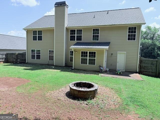 622 River Rock Cir, Jefferson, GA 30549 - back of house with an outdoor fire pit, a chimney, and a patio