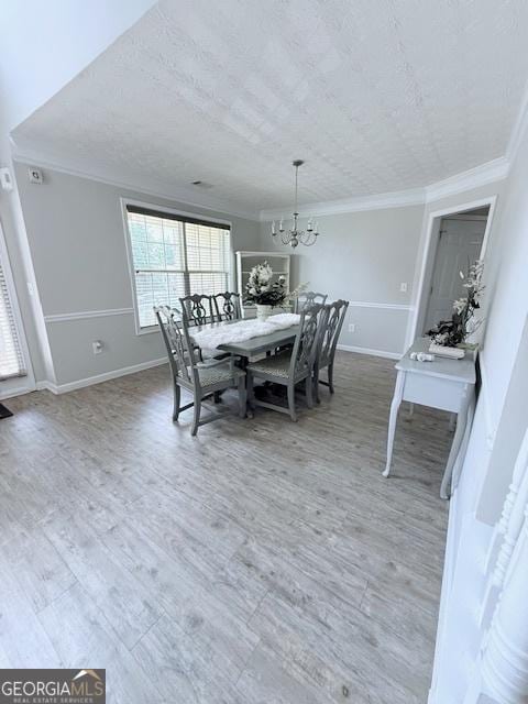 622 River Rock Cir, Jefferson, GA 30549 - dining room with crown molding, a chandelier, baseboards, and wood finished floors