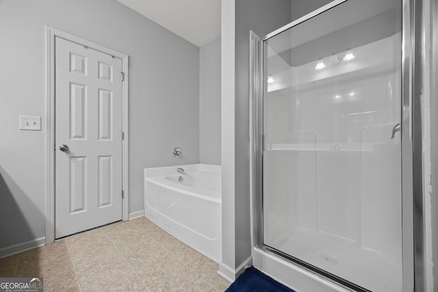 3203 Cyrus Point Ln, Kennesaw, GA 30152 - full bathroom featuring a shower stall, a garden tub, tile patterned flooring, and baseboards