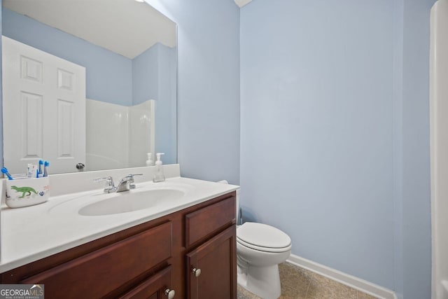 3203 Cyrus Point Ln, Kennesaw, GA 30152 - bathroom featuring toilet, vanity, baseboards, a shower, and tile patterned flooring