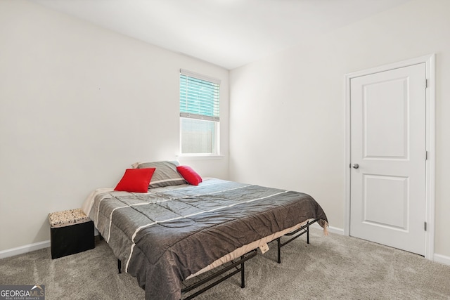 carpeted bedroom with baseboards