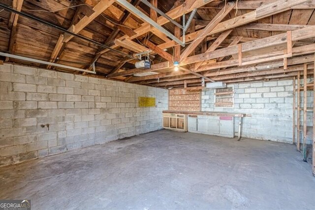 basement featuring concrete block wall