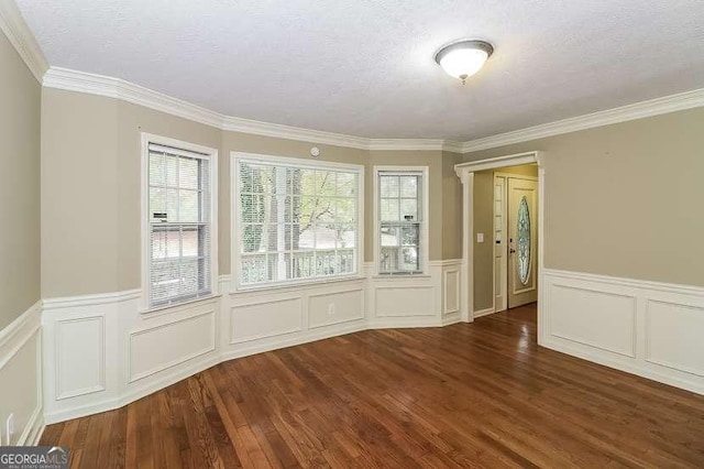 1960 Mceachern Manor Dr SW, Marietta, GA 30064 - spare room featuring wood finished floors, wainscoting, ornamental molding, and a decorative wall