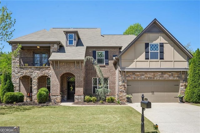 6565 Bentley Ridge Dr, Cumming, GA 30040 - view of front of house with stone siding, driveway, a front lawn, a garage, and a balcony