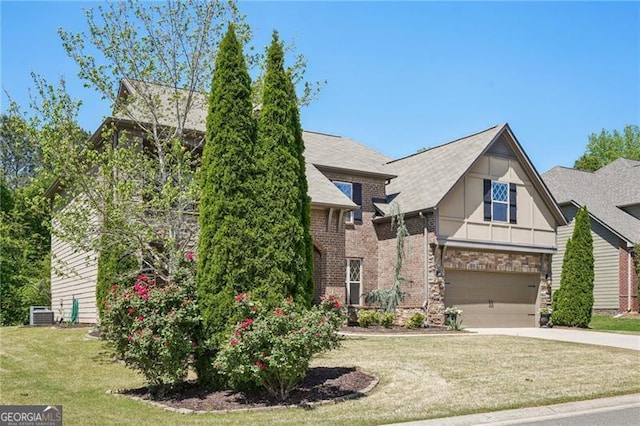 6565 Bentley Ridge Dr, Cumming, GA 30040 - tudor home with driveway, a garage, stone siding, a front lawn, and board and batten siding