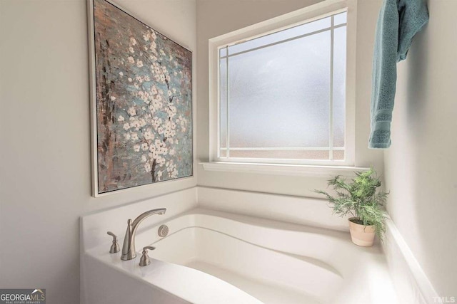full bathroom with a bath and a wealth of natural light